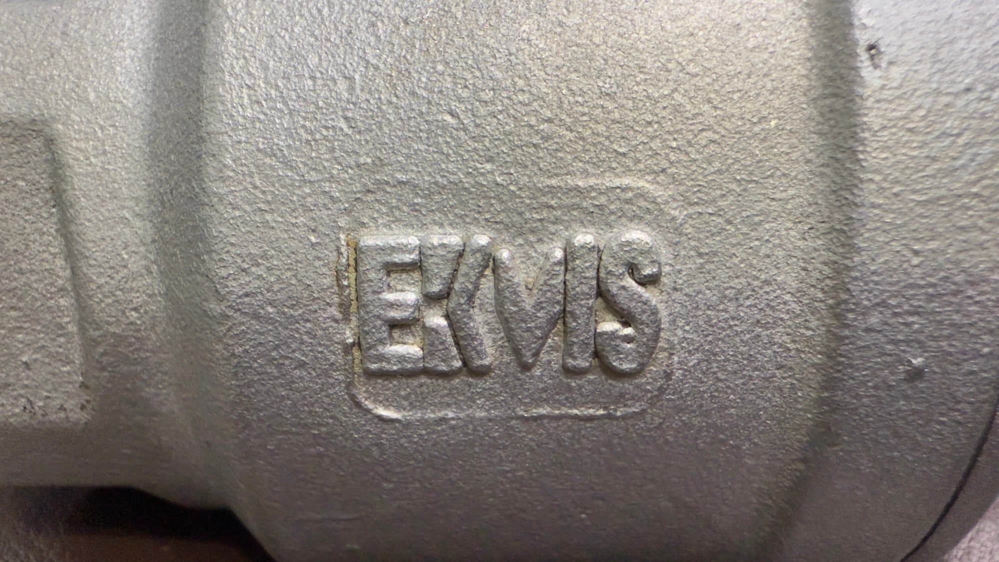 The EKVIS mark cast into a stainless steel valve body